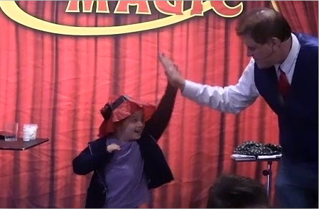 Ohio magician Ron Spangler performs at a company holiday party near Mansfield Ohio