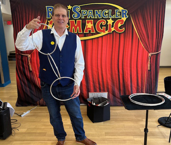 Magician Ron Spangler performs at an elementary school in Columbus Ohio