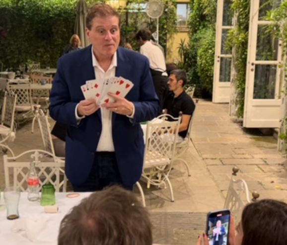 Central Ohio magician Ron Spangler performs table side close-up magic at a corporate dinner